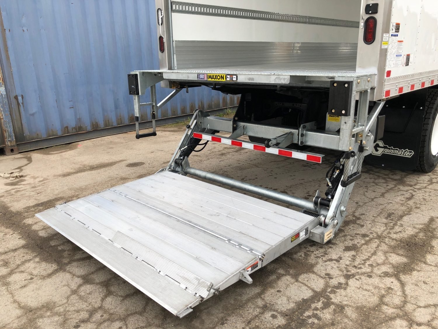 Hydraulic lift gate on commercial box truck — available on select MAXWIN rental units in BC